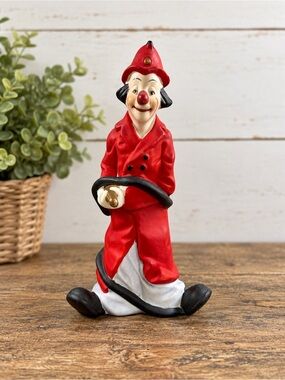 1979 Firefighter Clown Figurine Red Coat Fire Hose Collectible